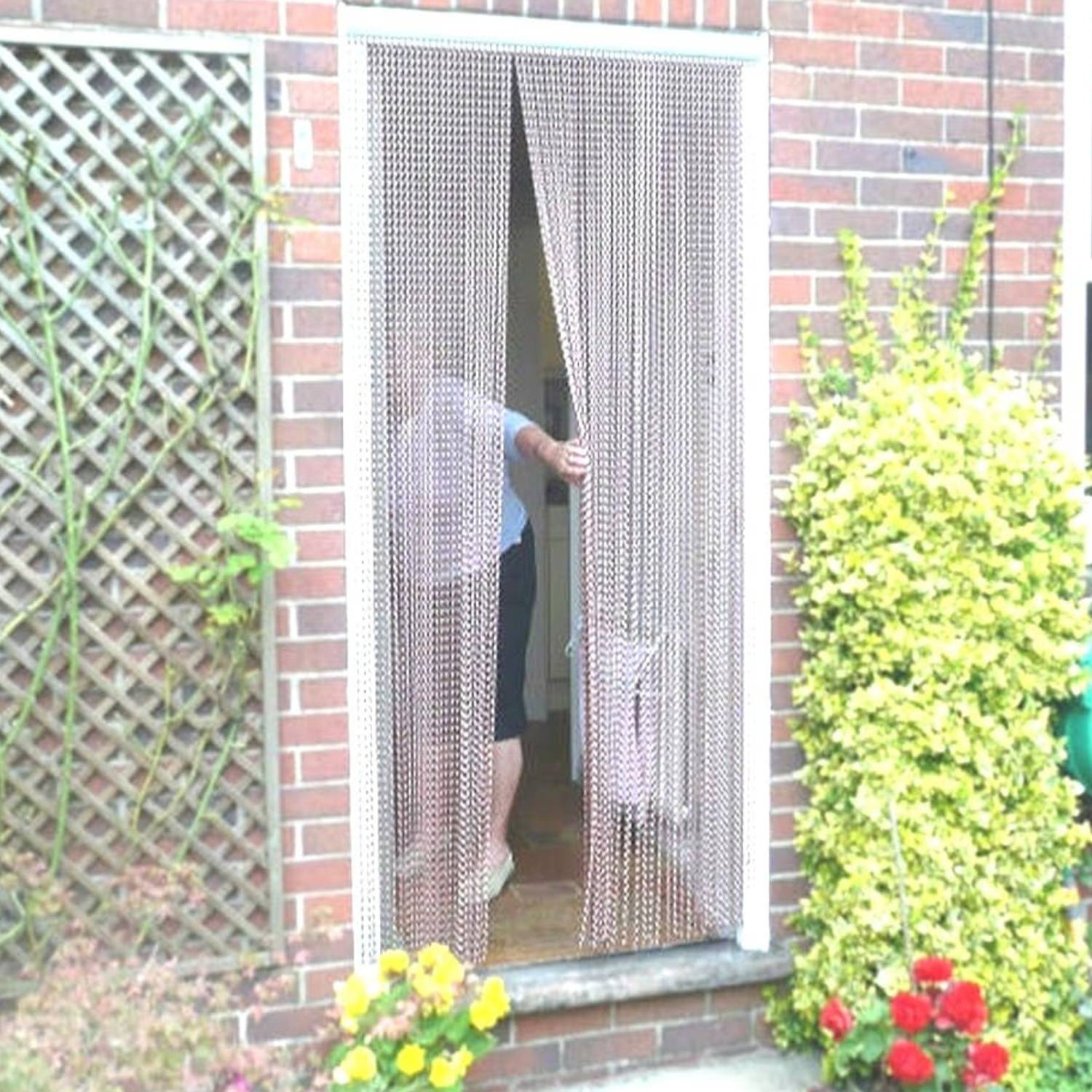 An aluminium chain curtain door hanging in an open doorway